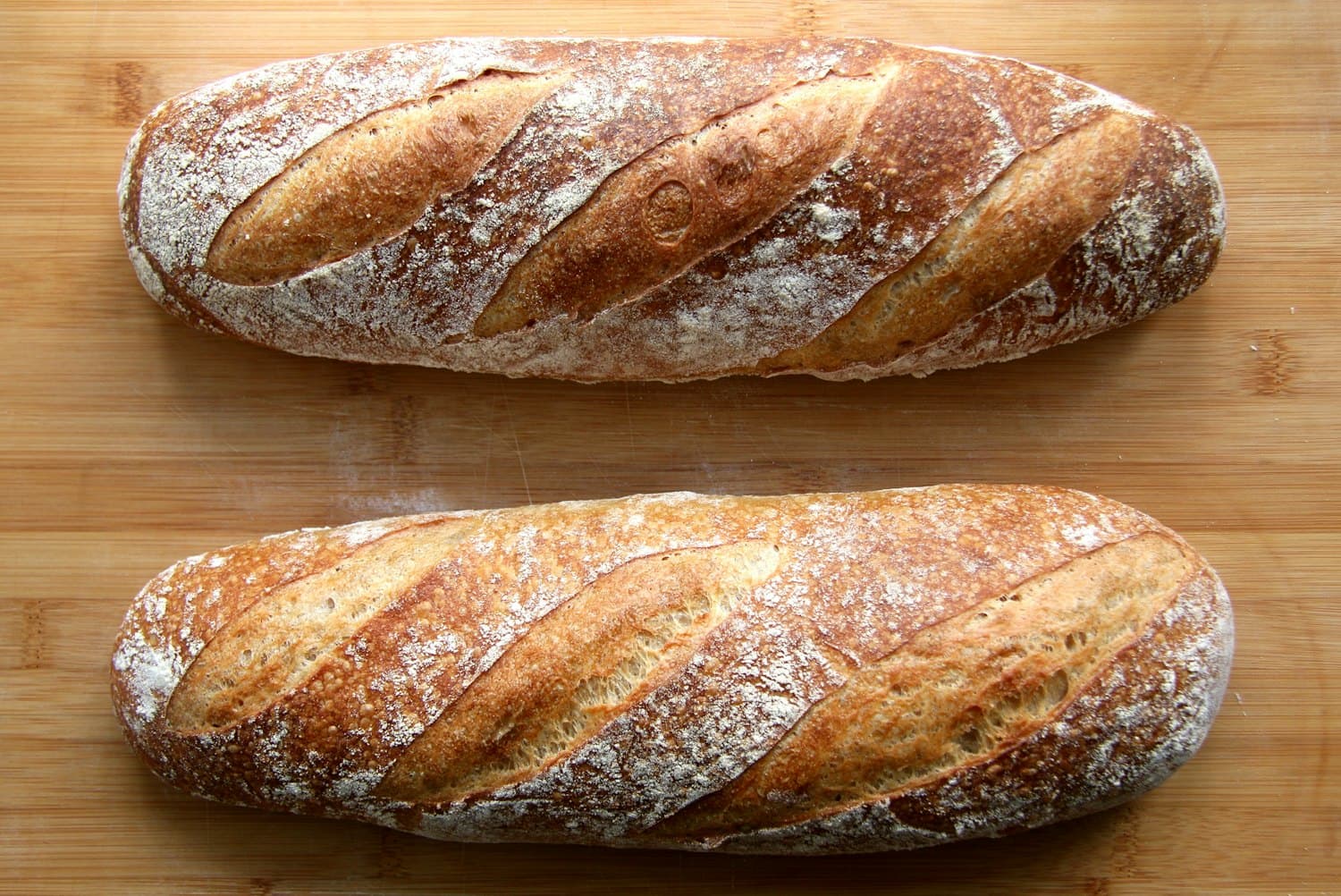 Slices of sourdough on a linen cloth with butter and honey